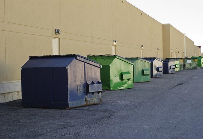 a group of construction workers taking a break near a dumpster in Creston NC